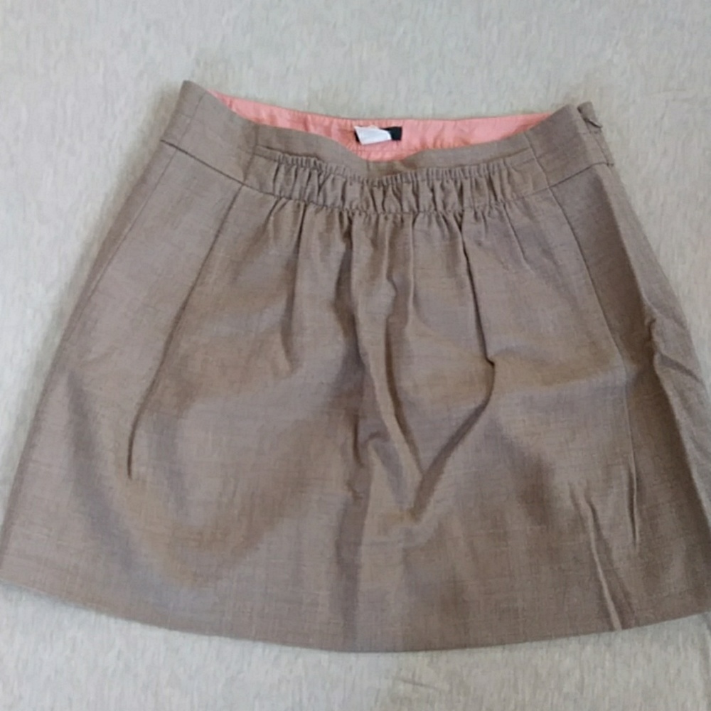 Tan pleated wool skirt with hidden pockets